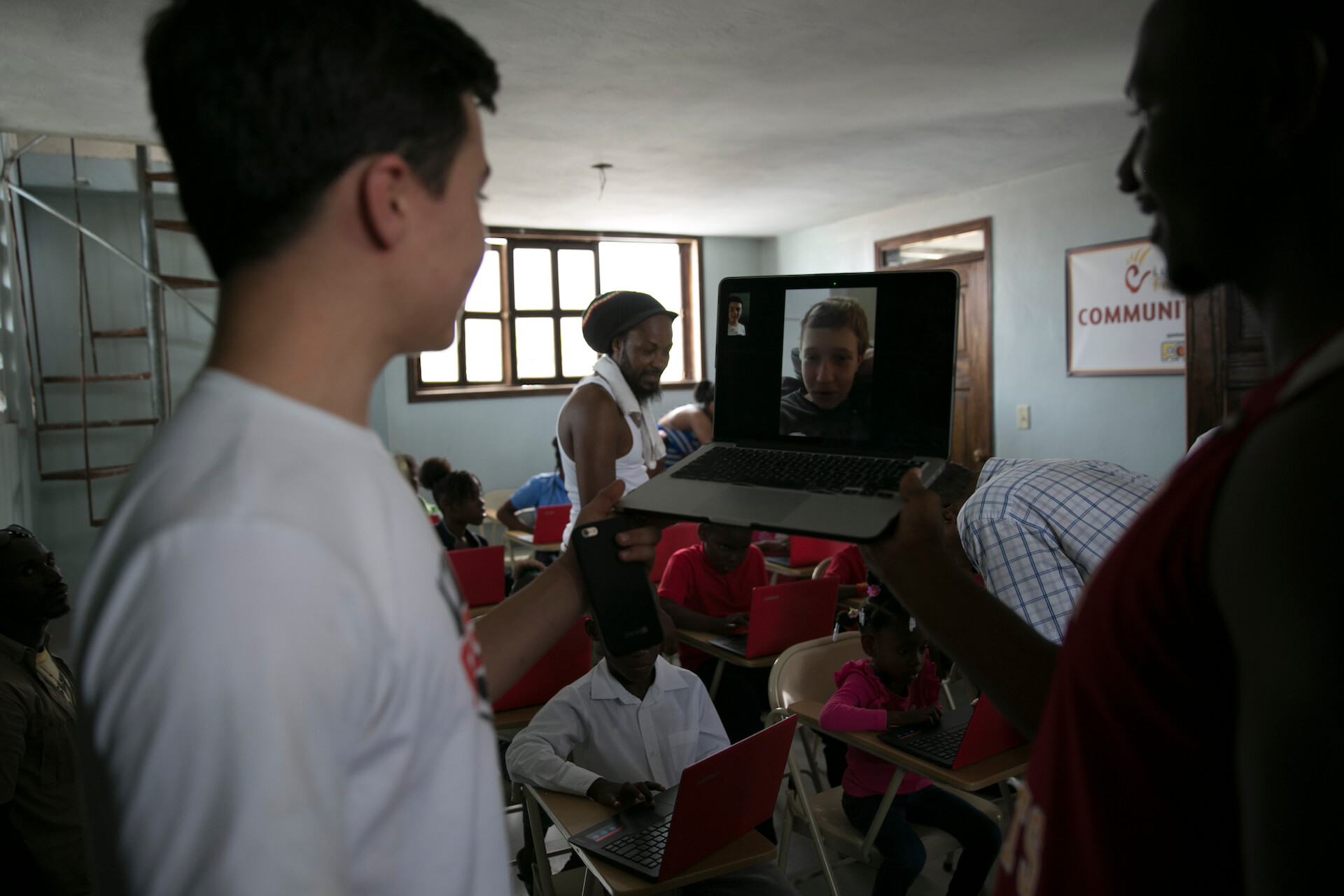Lorenzo Tobin, one of our A&M Student Atheletes, leads a Skype call between some of our sponsored students in Haiti and our student atheletes in New York. They got to meet each other and ask quesionts about their lives, 