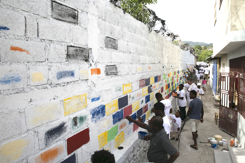 Over 50 people from the neighborhood came out to help us painting the walls leading up to the Community Center. 
